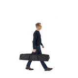 Carrying the padded bag that holds all the Vantage Point Products 10ft 3m Wi-Fi APoS tripod kit for office surveys