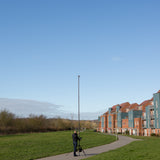 Vantage Point Products' 20ft 6m two storey camera mast for aerial imaging shown outdoors with a tripod