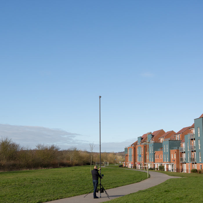 Vantage Point Products' 20ft 6m two storey camera mast for aerial imaging shown outdoors with a tripod