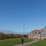 Vantage Point Products' 20ft 6m two storey camera mast for aerial imaging shown outdoors, being used as a monopod