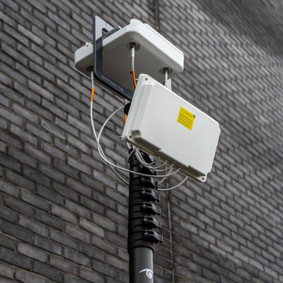 Tall stable warehouse Wi-Fi survey mast tripod with Cisco AP bracket and WiFiStand AP mount bracket safely attached