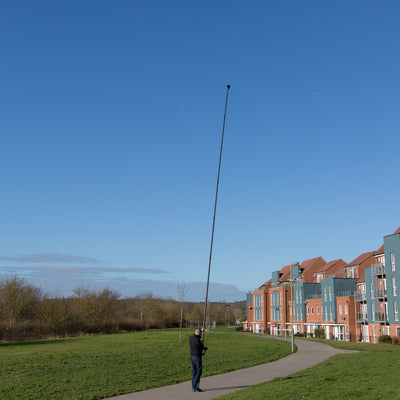 Highly stable and rigid carbon fibre photography mast being used as a monopod to inspect buildings and roofs by Vantage Point Products
