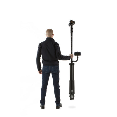 Lightweight and portable carbon fibre aerial photography mast and tripod being held one-handed